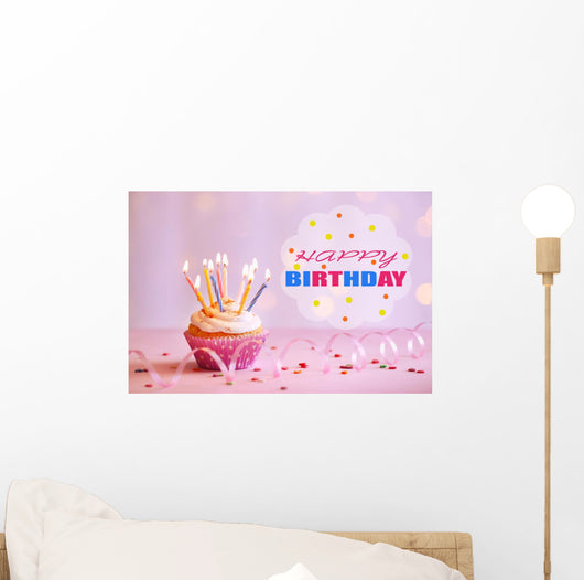 Delicious birthday cupcake on table on bright background Wall Decal