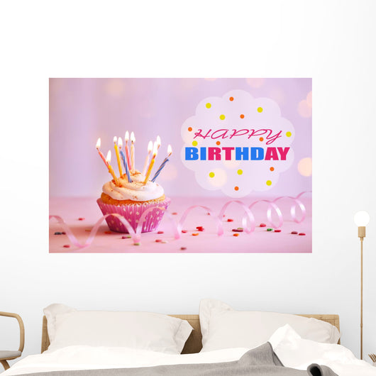 Delicious birthday cupcake on table on bright background Wall Decal