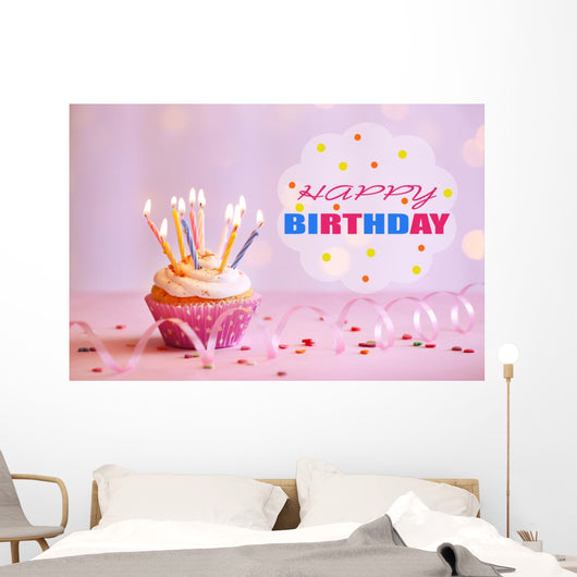 Delicious birthday cupcake on table on bright background Wall Decal