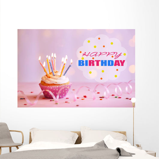 Delicious birthday cupcake on table on bright background Wall Decal