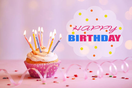 Delicious birthday cupcake on table on bright background Wall Decal