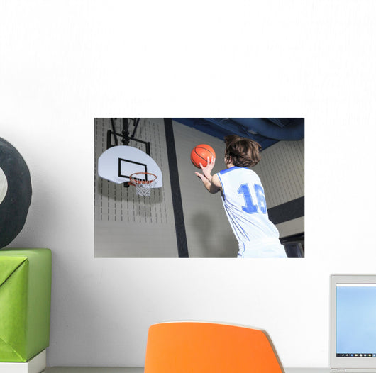 A teenager basketball player play his favorite sport Wall Decal