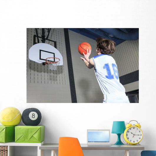 A teenager basketball player play his favorite sport Wall Decal