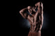 a young and fit male model posing his muscles Wall Decal