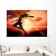 Composite image of side view of a sporty young woman stretching Wall Decal