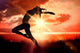Composite image of side view of a sporty young woman stretching Wall Decal