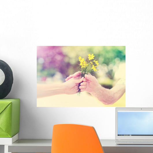 Elderly and young woman holding flowers outside Wall Decal