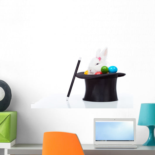 Cute white rabbit with colorful easter eggs in magician hat Wall Decal