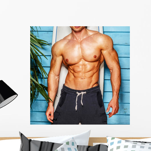 Studio shot,surfer and his swimming deck Wall Decal