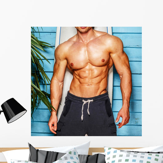 Studio shot,surfer and his swimming deck Wall Decal