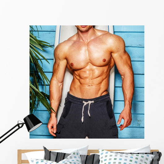 Studio shot,surfer and his swimming deck Wall Decal