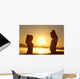 Silhouette of a fitness couple stretching at sunrise Wall Decal