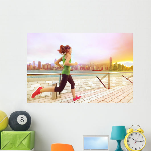 Urban runner woman jogging in Hong Kong at sunset Wall Decal