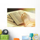 Hands of old woman with Bible on table Wall Mural