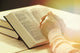 Hands Of Old Woman With Bible On Table Wall Decal