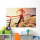 young fitness woman running on seaside stone stairs Wall Mural