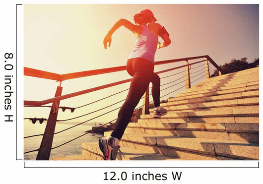 young fitness woman running on seaside stone stairs Wall Mural