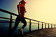 Young Fitness Woman Running On Sunrise Seaside Boardwalk Wall Decal 2