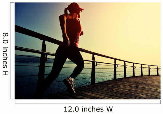 young fitness woman running on sunrise seaside boardwalk Wall Mural