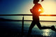 Young Fitness Woman Running On Sunrise Seaside Boardwalk Wall Decal