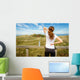 Athletic woman touching neck and back muscles by injury Wall Mural