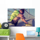 Tired/injured jogger on a big bridge. Wall Mural