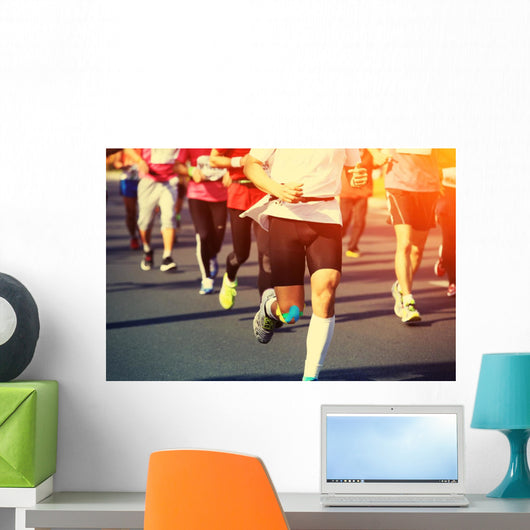 marathon runner legs running on city street Wall Mural