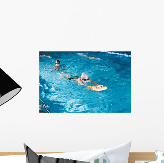 Activities on the pool young boy swimming fitness Wall Mural