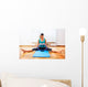 Fitness teacher making exercisese with the circle tool Wall Mural