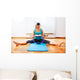 Fitness teacher making exercisese with the circle tool Wall Mural