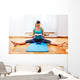 Fitness teacher making exercisese with the circle tool Wall Mural