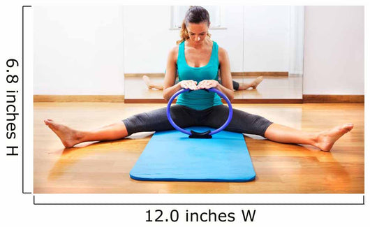 Fitness teacher making exercisese with the circle tool Wall Mural