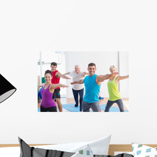 People doing warrior pose in yoga class Wall Decal
