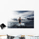 Young woman athlete running out of water Wall Mural