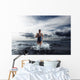 Young woman athlete running out of water Wall Mural