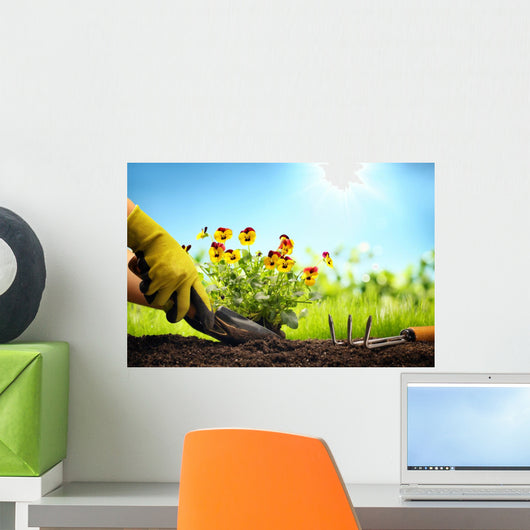 Planting Flowers in a garden Wall Mural