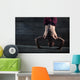 Athlete with naked torso doing push-ups on his hands while stand Wall Mural