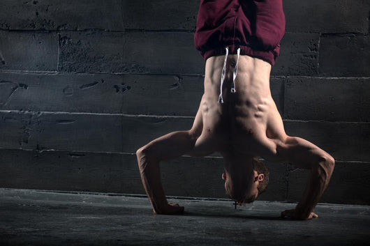 Athlete With Naked Torso Doing Push-Ups On His Hands While Stand Wall Decal