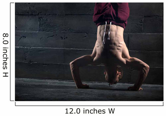 Athlete with naked torso doing push-ups on his hands while stand Wall Mural