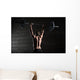 Portrait of a handsome athlete from behind. Athlete raises the b Wall Mural