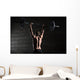 Portrait of a handsome athlete from behind. Athlete raises the b Wall Mural