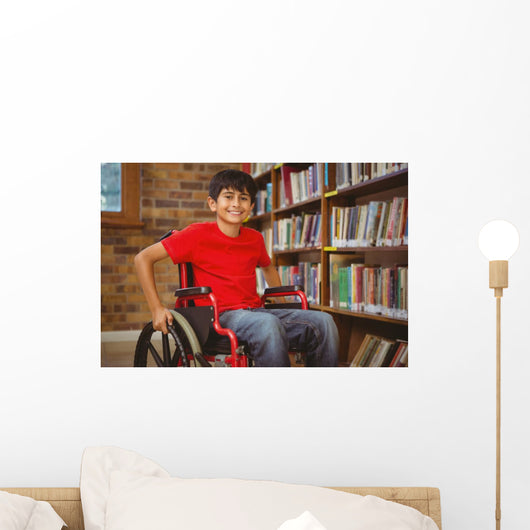 Portrait of boy sitting in wheelchair at library Wall Mural