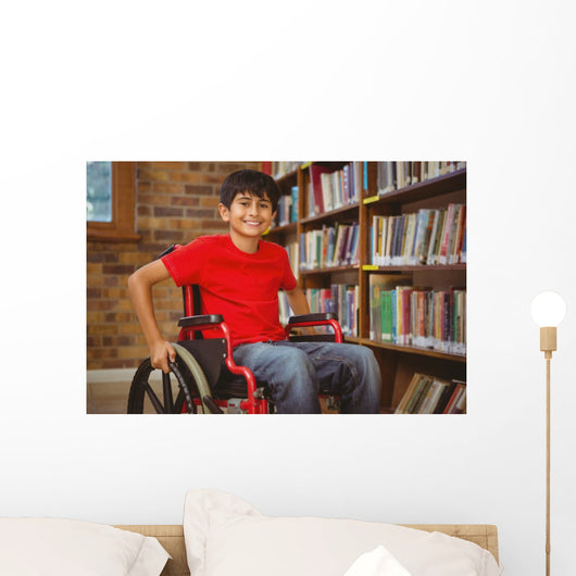 Portrait of boy sitting in wheelchair at library Wall Mural