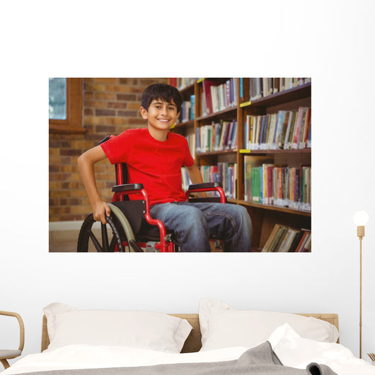 Portrait of boy sitting in wheelchair at library Wall Mural
