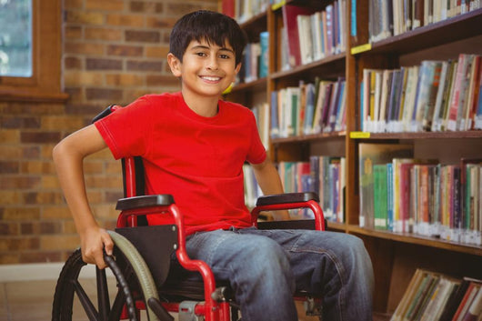 Portrait Of Boy Sitting In Wheelchair At Library Wall Decal
