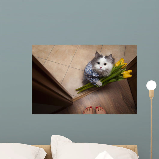 cat with a bouquet at the feet of mistress Wall Mural
