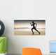 Composite image of pretty fit blonde jogging Wall Mural