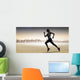 Composite image of pretty fit blonde jogging Wall Mural