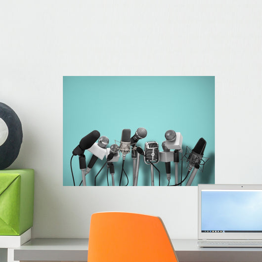 Press conference with standing microphones. Wall Mural