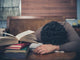 Tired Student Surrounded Books Wall Decal